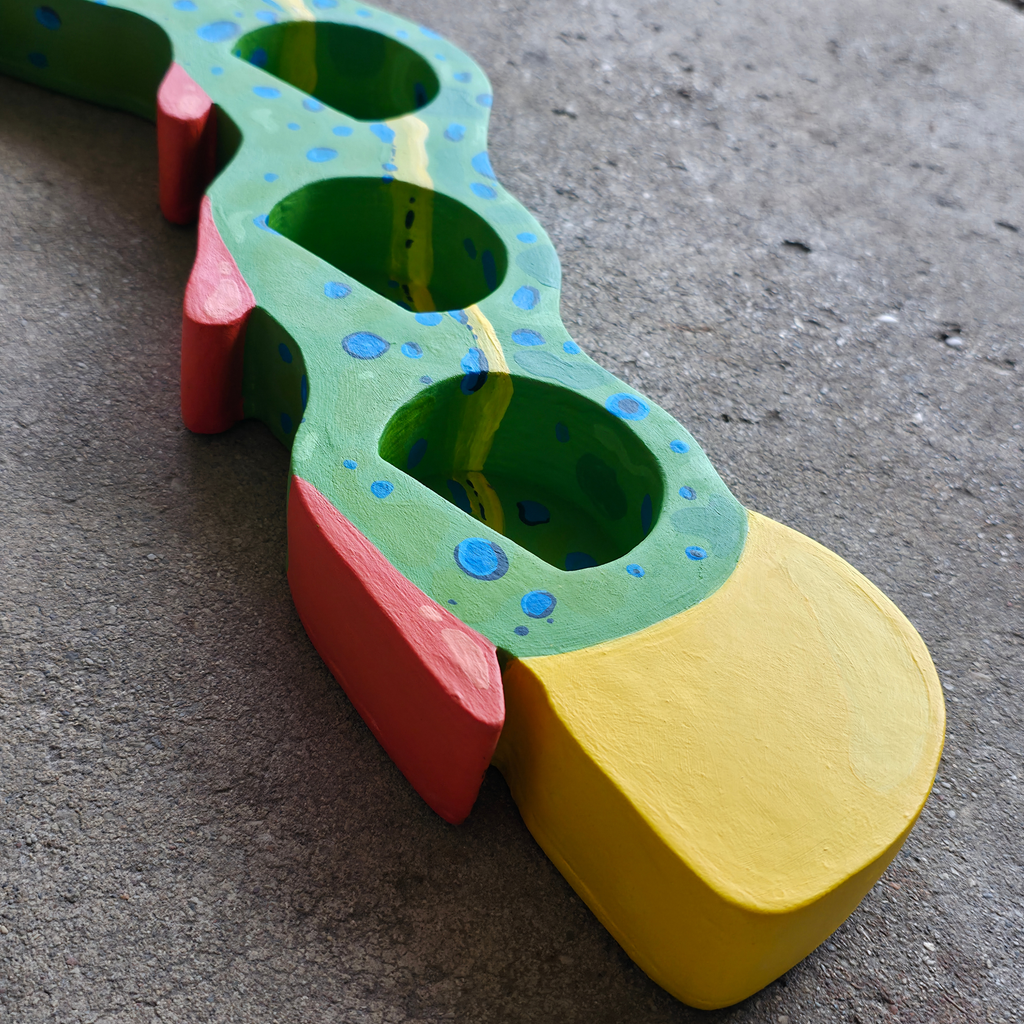 Caterpillar trinket shelf